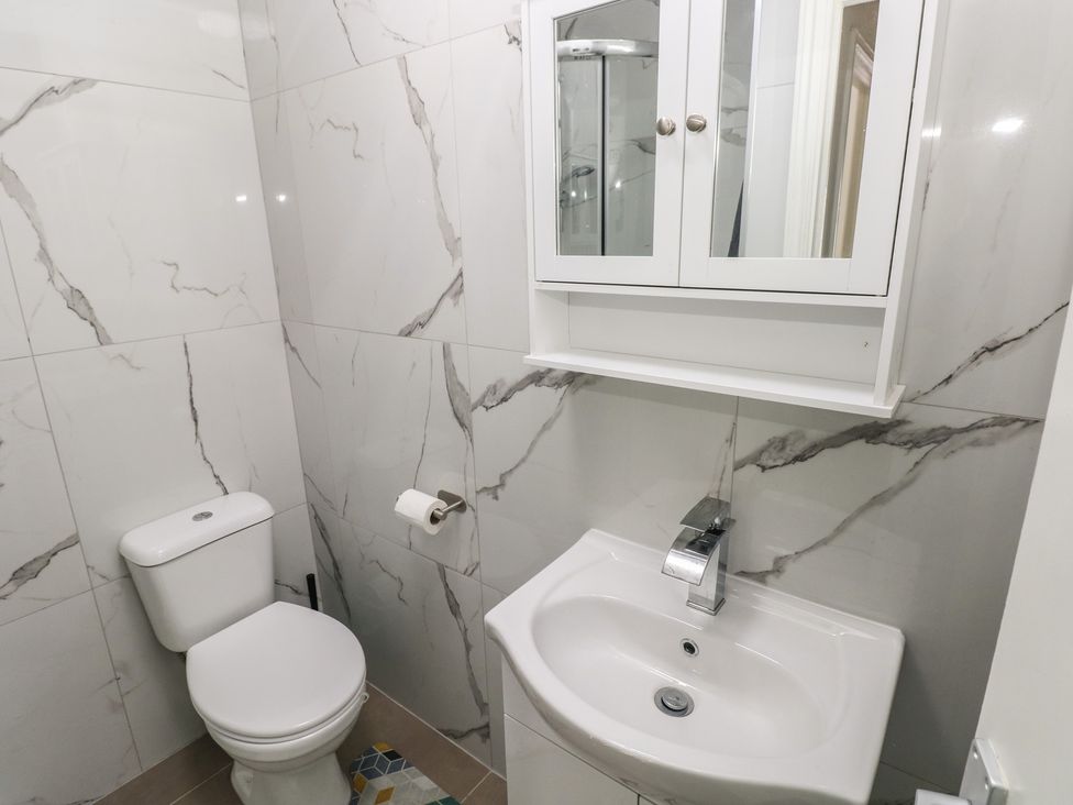 A bathroom with a sink and toilet at 5 Gelli Terrace in Caerphilly