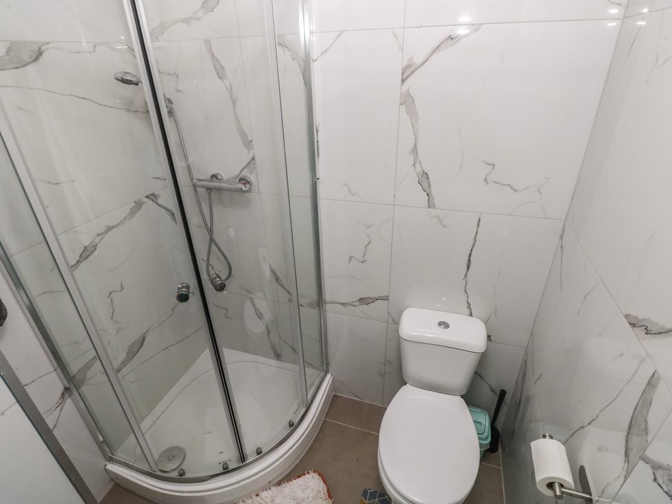 A bathroom with a shower and toilet at 5 Gelli Terrace Caerphilly