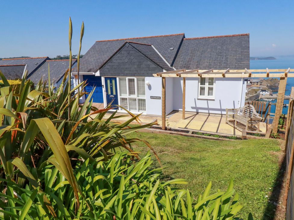 A house with a garden and a deck at Trewollock in Mevagissey