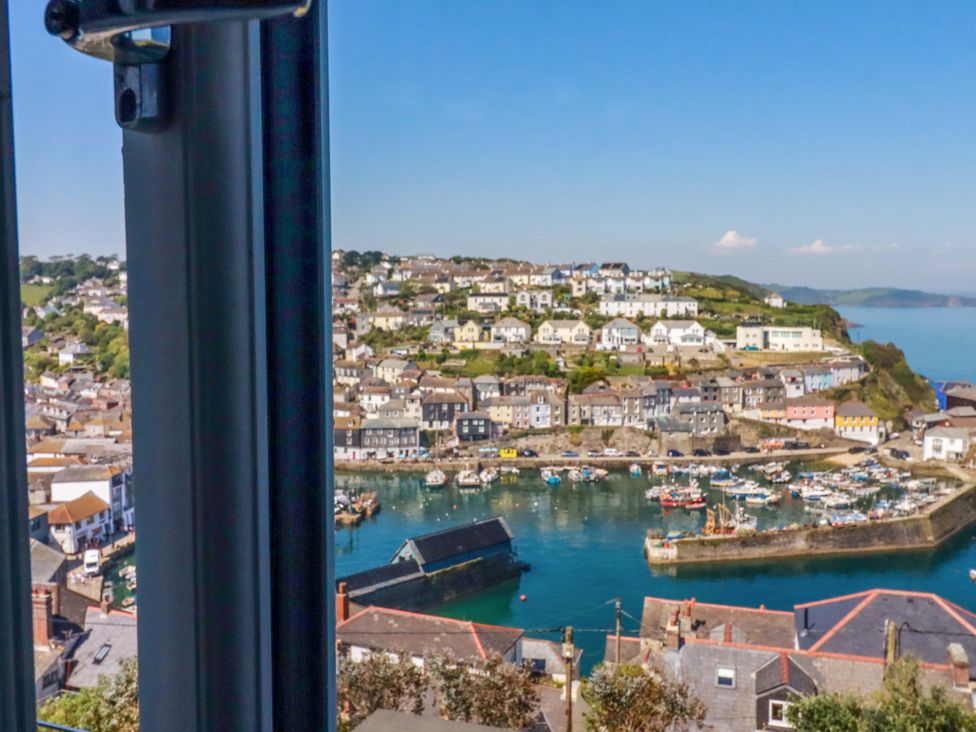 A view of a harbor with houses and boats at Trewollock in Mevagissey