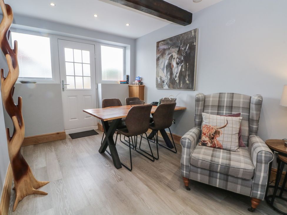 A dining room with a table and chairs at Barn 1 Day Green near Rode Heath
