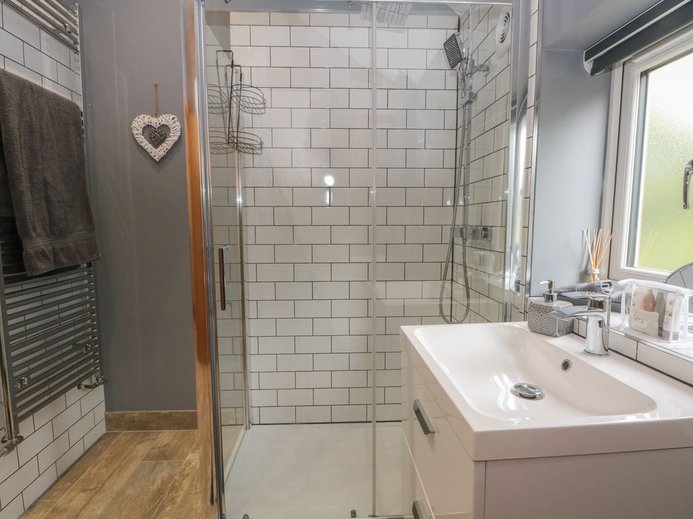 A bathroom with a shower and sink at Barn 1 Day Green near Rode Heath