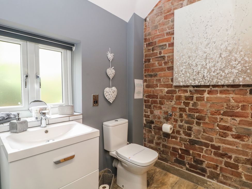 A bathroom with a sink and toilet at Barn 1 Day Green near Rode Heath