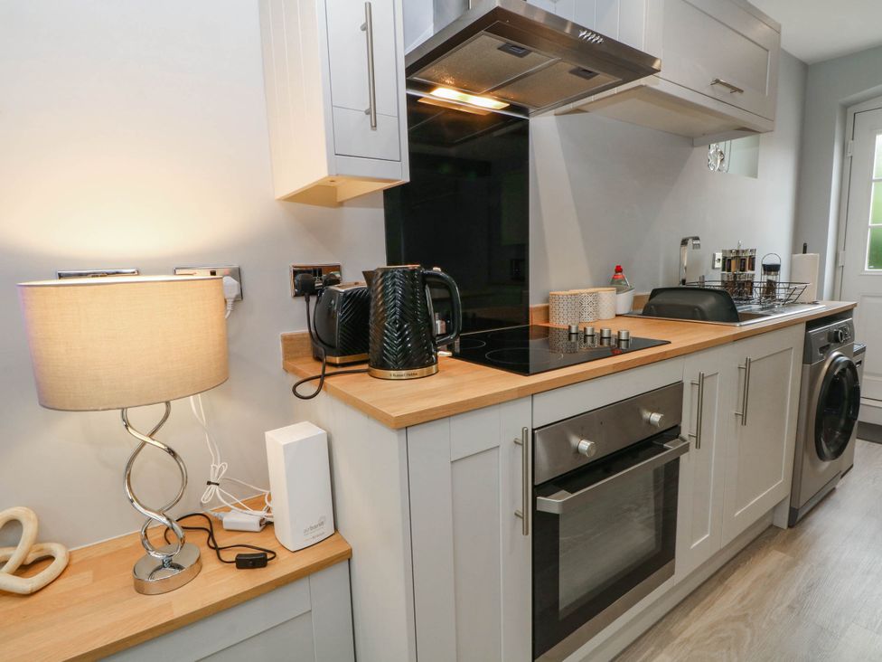 A kitchen with oven and kettle at Barn 2 Day Green near Rode Heath