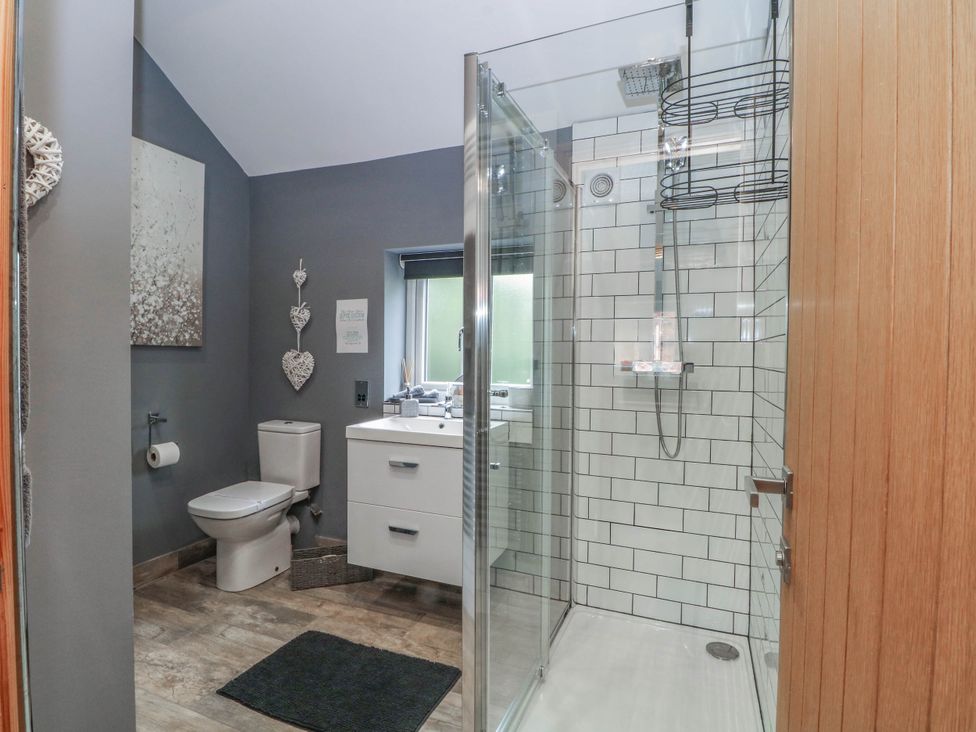 A bathroom with a shower and sink at Barn 2 Day Green near Rode Heath