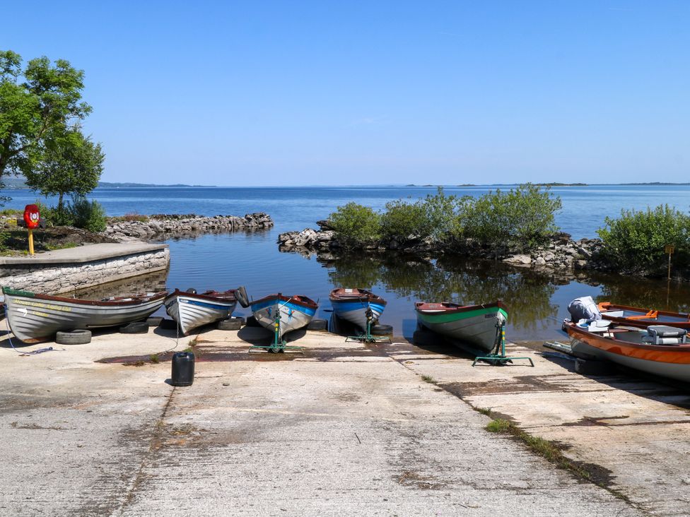 A view of boats on a lake at Mayfly Cottage
