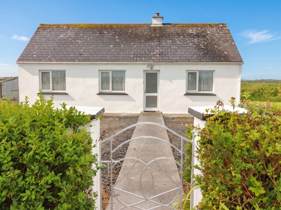 A house with a pathway leading to the entrance at Golf Club View, County Clare