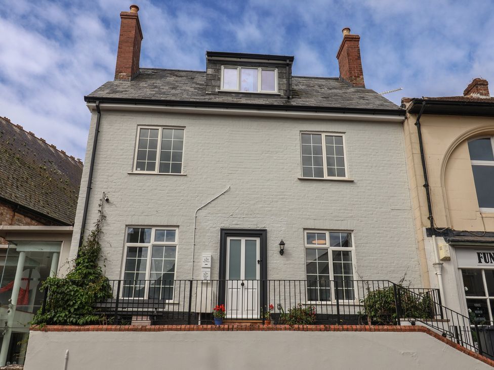 A house with multiple windows and a door at Flat 1 Harley House in Sidmouth