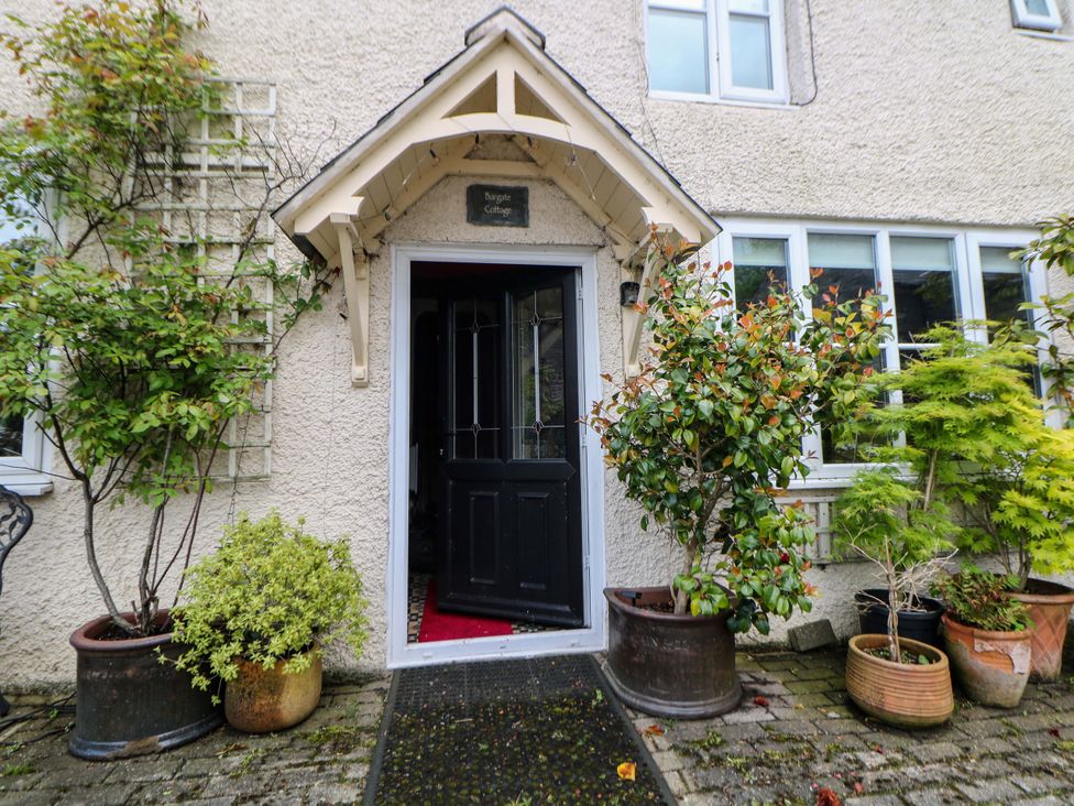 An entrance with plants and a door at Bargate Cottage in Hope Valley