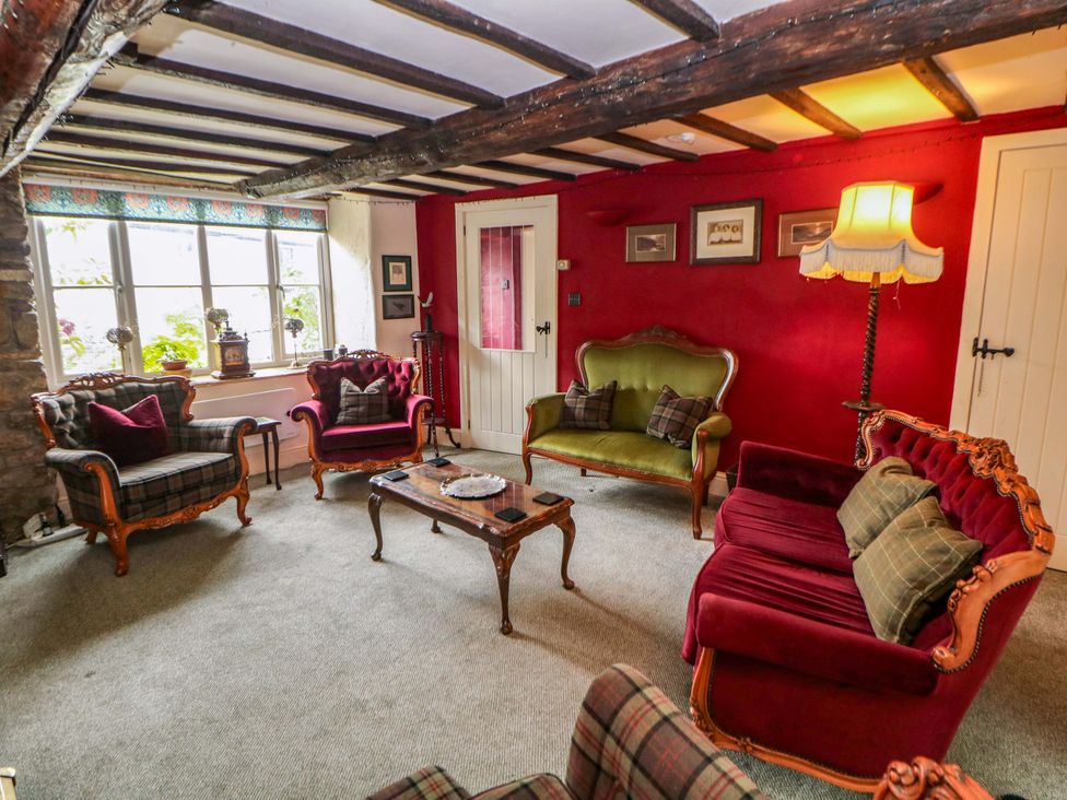 A living room with sofas and a coffee table at Bargate Cottage in Hope Valley