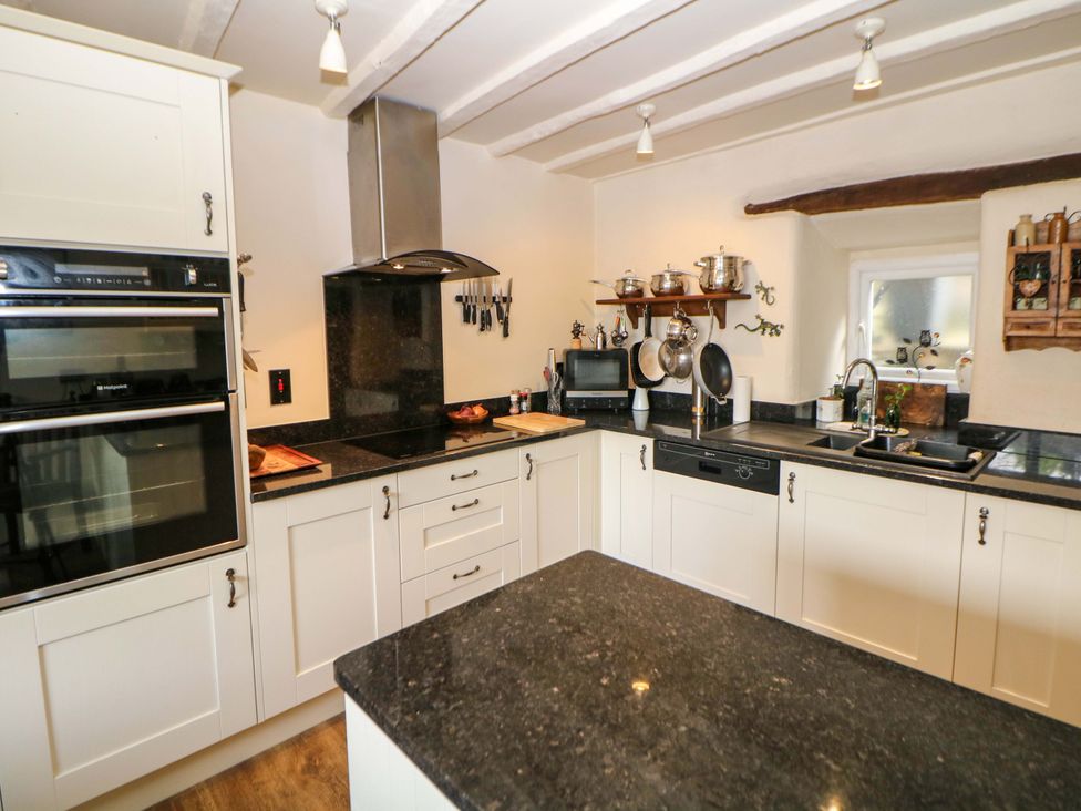 A kitchen with appliances and utensils at Bargate Cottage in Hope Valley
