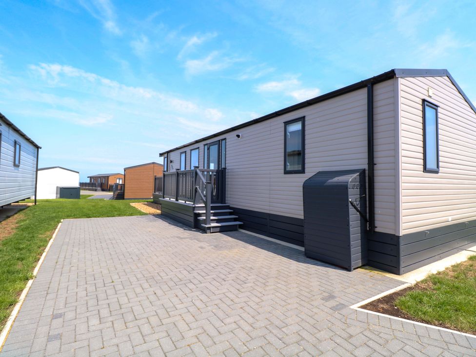 A mobile home with steps and a parking area at Sandy Shores Retreat in Norwich