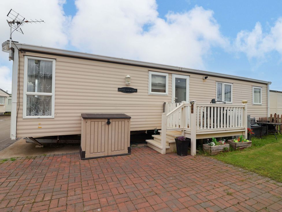 A mobile home with porch and outdoor furniture at Winchester - 478 Abergele