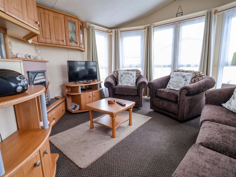 A living room with a television and sofas at Winchester - 478 Abergele