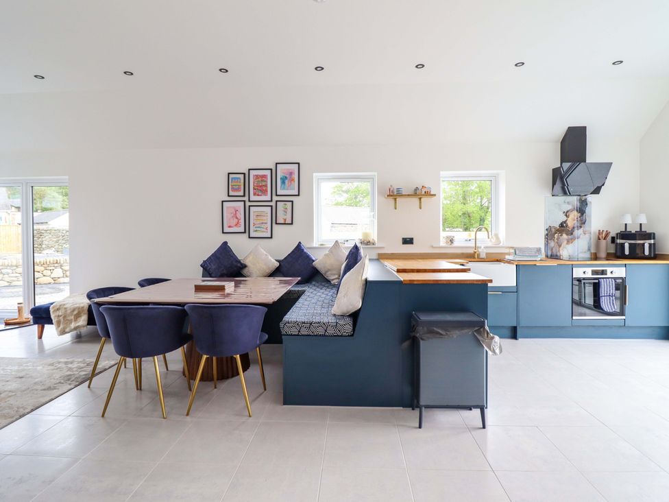 A kitchen with dining area and modern appliances at Kingfisher