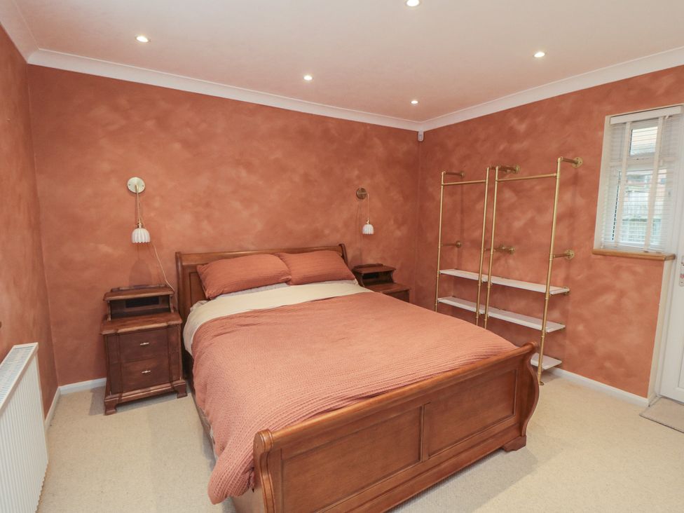 A bedroom with a bed and nightstand at The Joinery in Scarborough