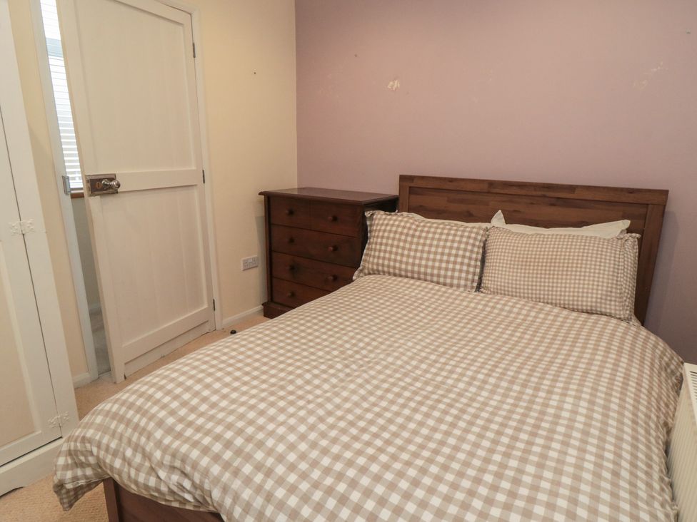 A bedroom with a bed and a dresser at The Joinery in Scarborough