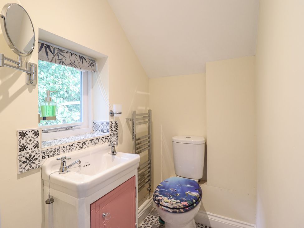 A bathroom with a sink and toilet at Hay Loft at Ebenezer Chapel Milwr
