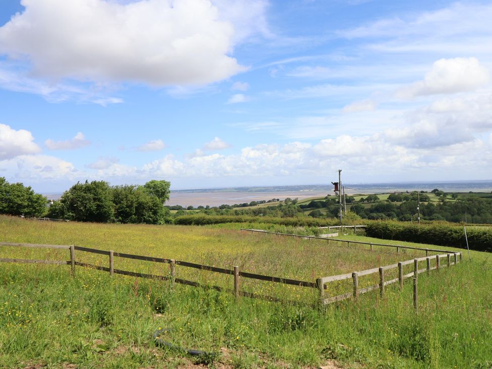 A field with grass and trees at Hay Loft at Ebenezer Chapel Milwr