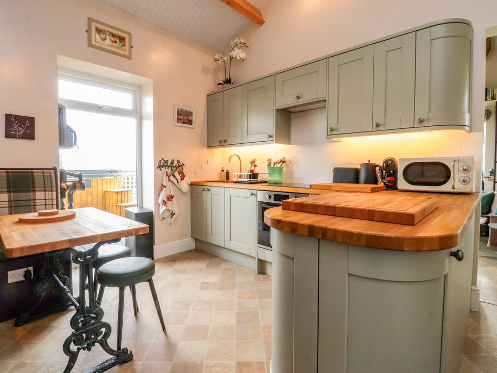A kitchen with cabinets countertop and appliances at The View in Ilkley