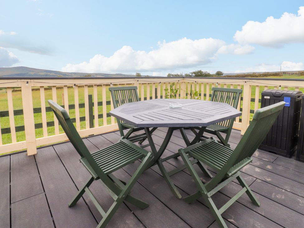 An outdoor seating area with a table and chairs at The View in Ilkley