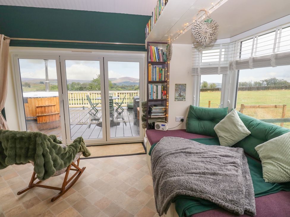 A snug with seating area and bookshelves at The View near Addingham