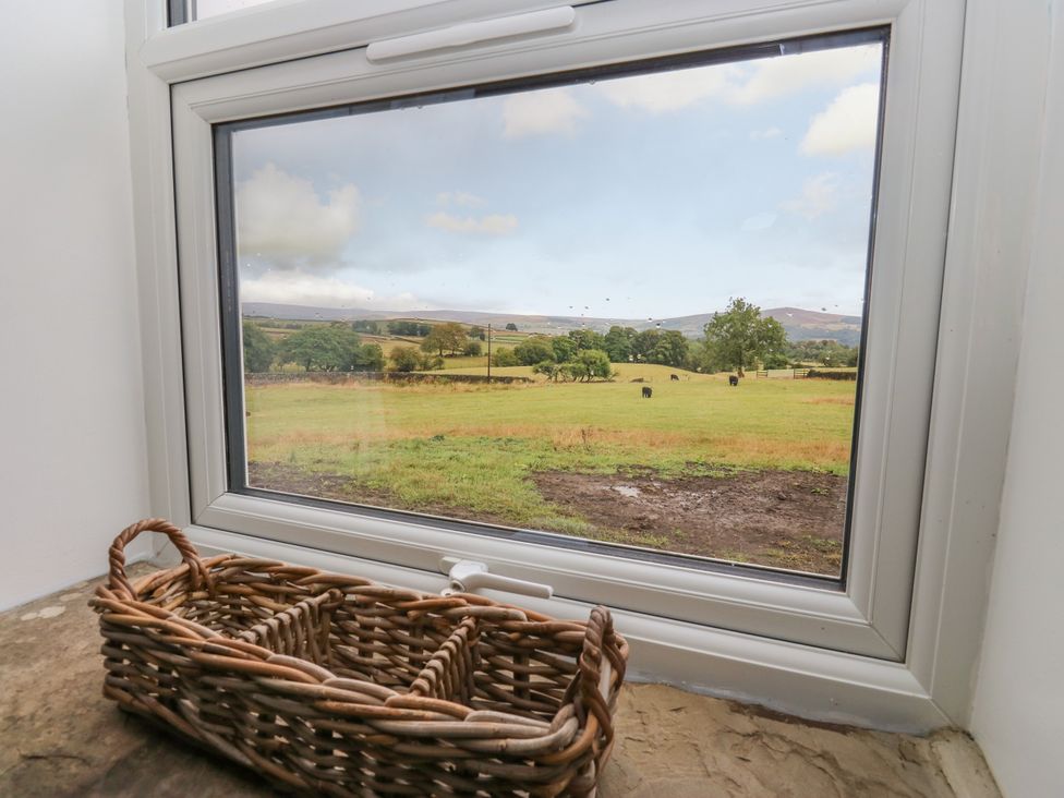 A window with a view of cattle and fields at The View near Addingham