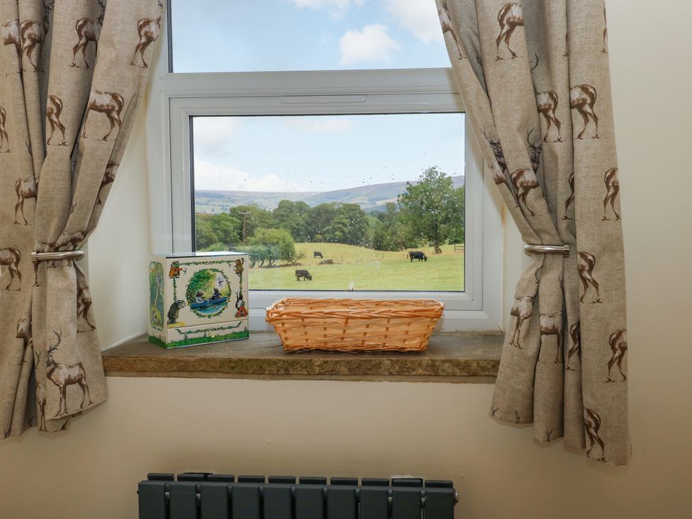 A window with a view and objects on the sill at The View near Addingham