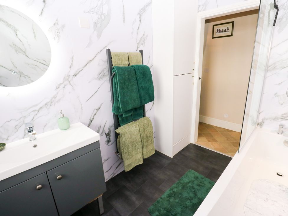 A bathroom with a sink and towels at The View near Addingham