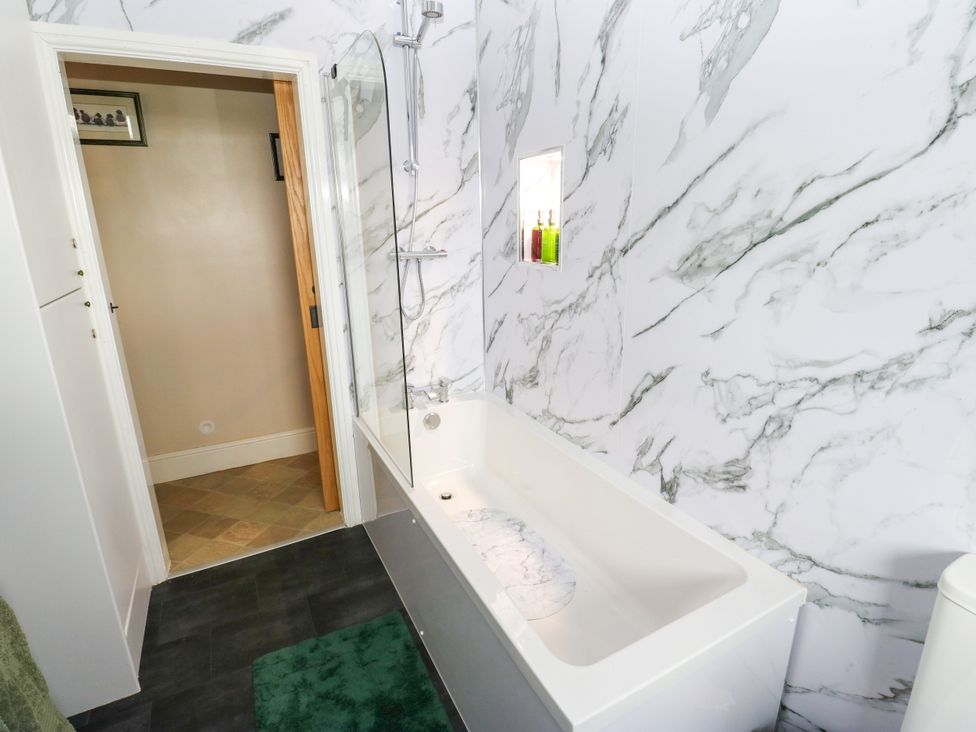 A bathroom with a bathtub and shower at The View near Addingham
