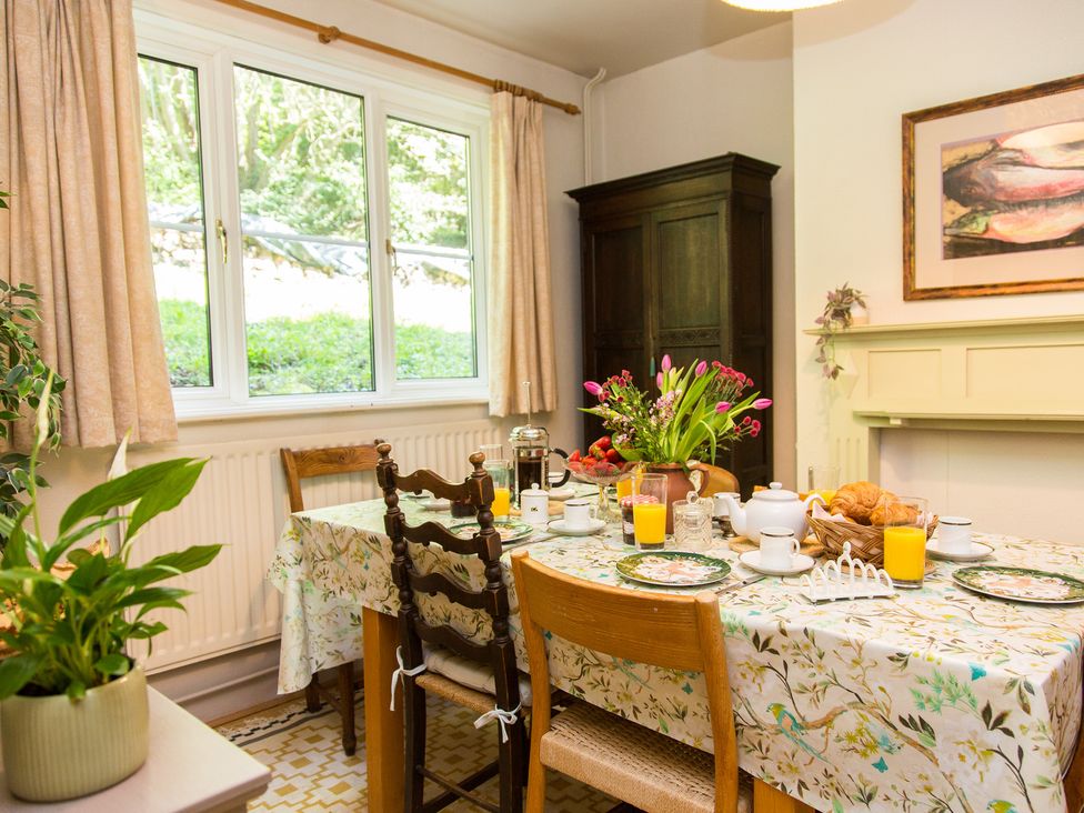 A dining room with a table set for breakfast at Whitebeams Pett Bottom near Stelling Minnis