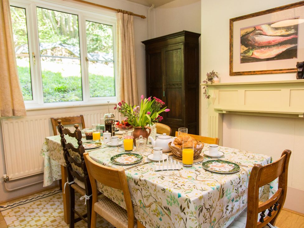 A dining room with a table set for breakfast at Whitebeams Pett Bottom near Stelling Minnis