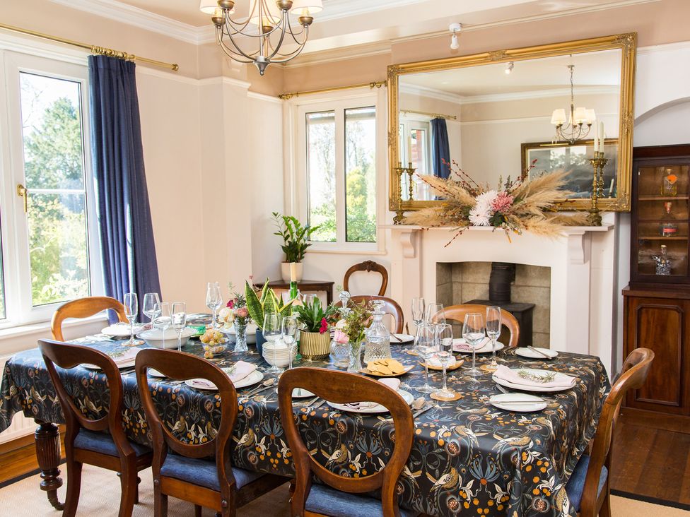 A dining room with a table set for dinner at Whitebeams in Pett Bottom near Stelling Minnis