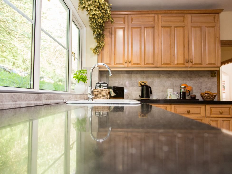 A kitchen with a sink and cabinets at Whitebeams in Pett Bottom near Stelling Minnis