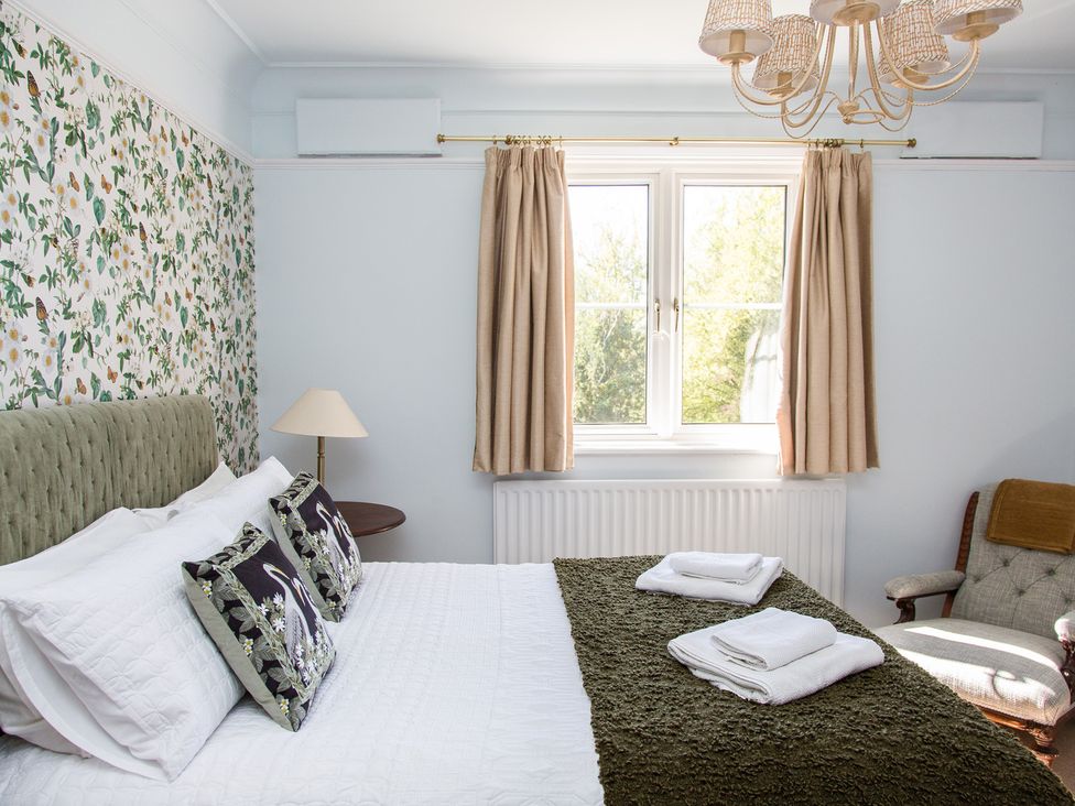 A bedroom with a bed and window at Whitebeams Pett Bottom near Stelling Minnis