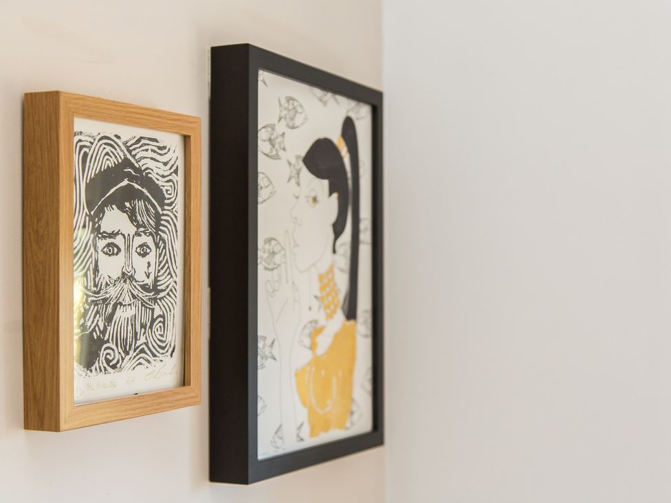 Framed artwork of a person and a woman at Whitebeams Pett Bottom near Stelling Minnis