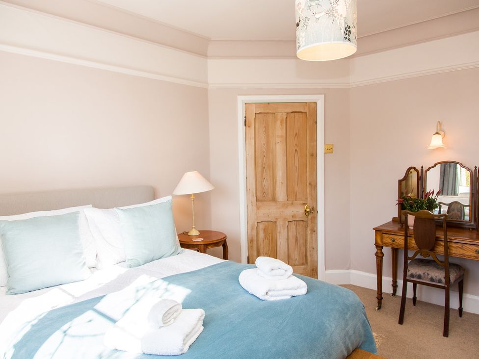 A bedroom with a bed and vanity table at Whitebeams Pett Bottom near Stelling Minnis