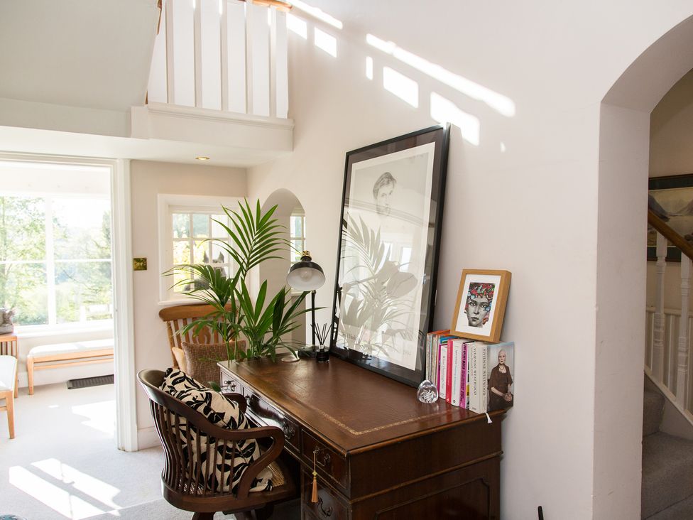 A study with a desk, chair, and lamp at Whitebeams Pett Bottom near Stelling Minnis