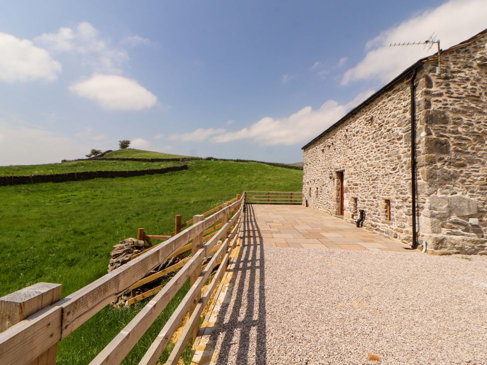 An exterior view of a building with a paved area at Dam House Barn Lancaster