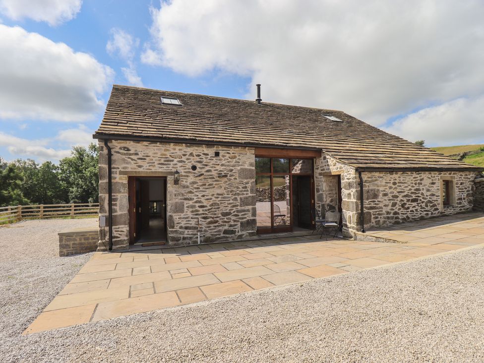 An outdoor area with a stone building at Dam House Barn Austwick