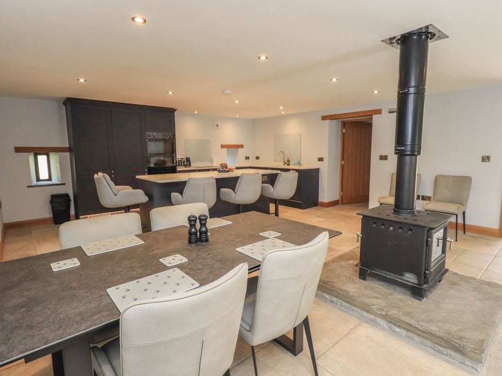 A kitchen with a table and chairs at Dam House Barn Austwick