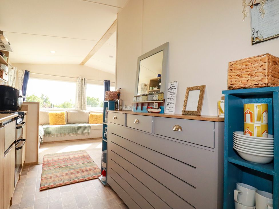 A kitchen with a dresser and a couch at 5 Silverbow