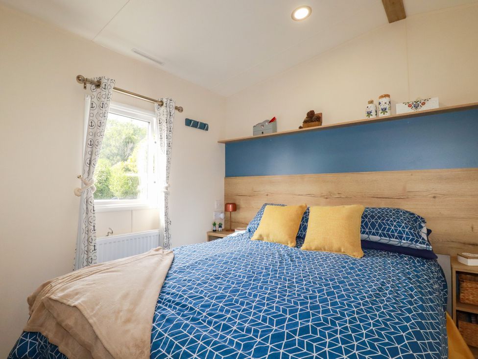 A bedroom with a bed and window at 5 Silverbow