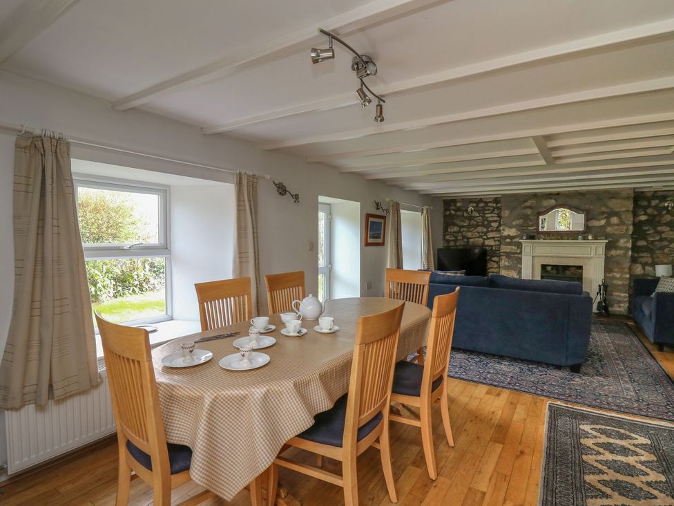 A dining room with a table set for tea at Tegfan in Newport
