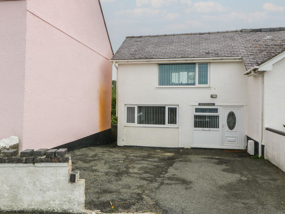 A house with a driveway next to another building at Porth Ewyn House in Trearddur Bay