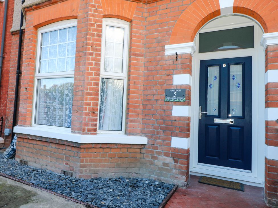 The entrance with a blue door and brickwork at Fernleigh in Margate