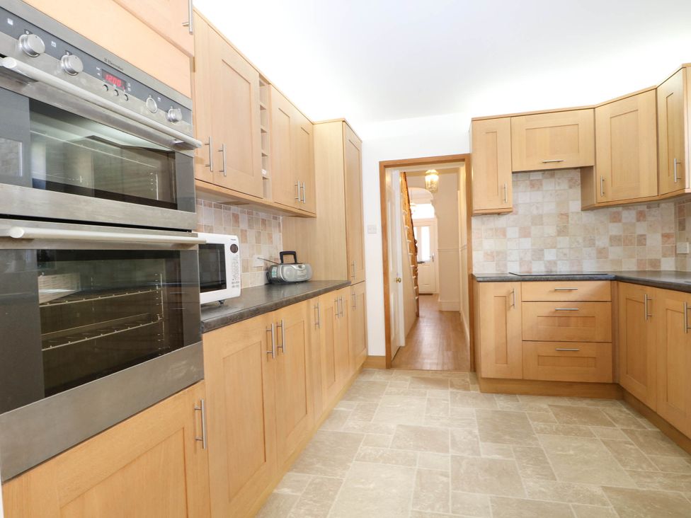 A kitchen with cabinets and appliances at Fernleigh in Margate