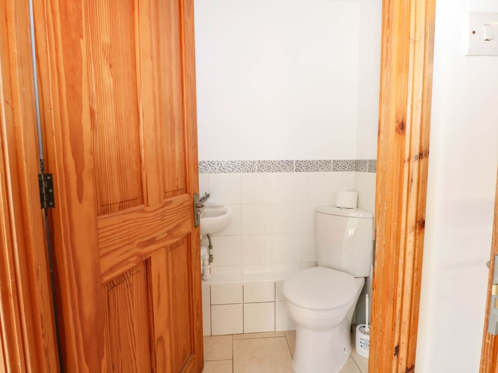 A bathroom with a toilet and a sink at Fernleigh in Margate