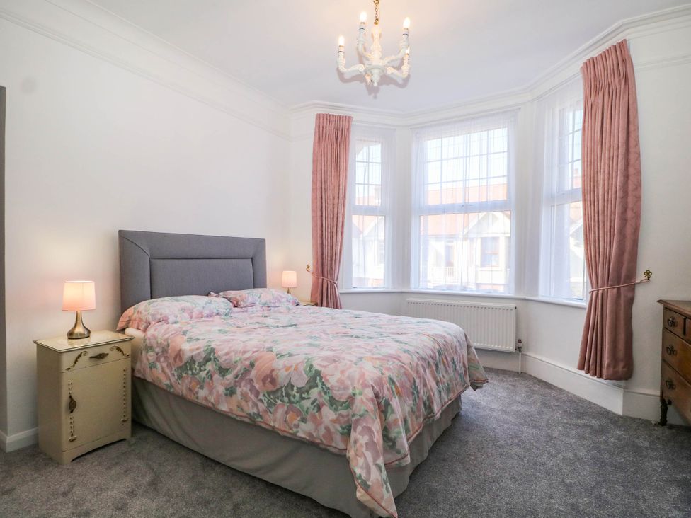 A bedroom with a bed and bedside table at Fernleigh in Margate