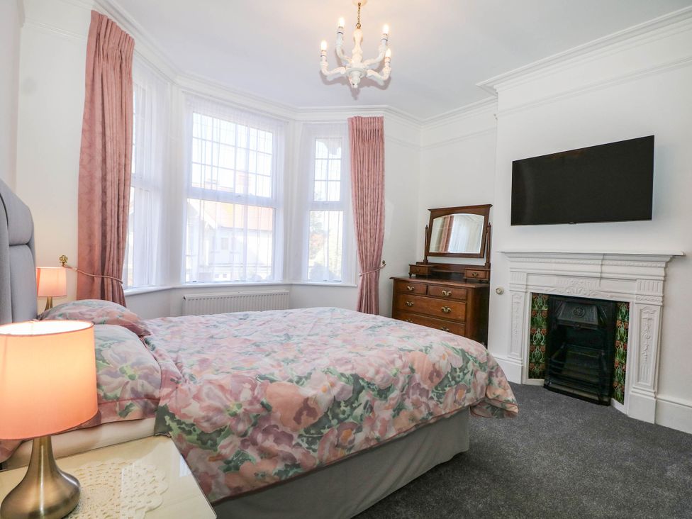A bedroom with a bed and television at Fernleigh in Margate
